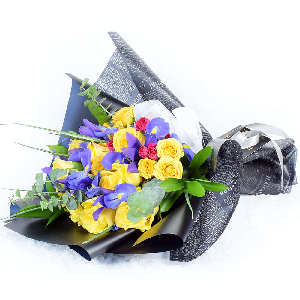Premium Mixed Floral Bouquet Featuring Roses, Irises, and Eucalyptus – how the gift is presented