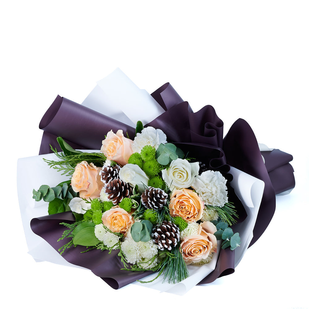 Tied Floral Wrap Bouquet Featuring Roses and Seasonal Greenery – how the gift is presented