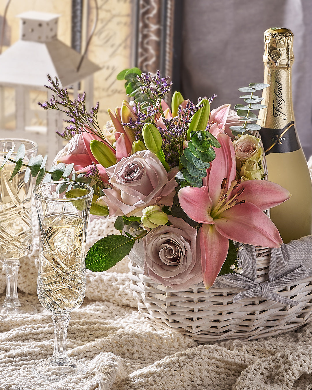 Flower arrangement paired with wine gift set prepared for delivery