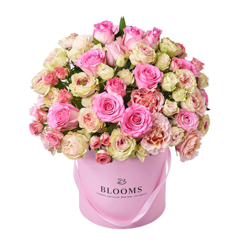 This large floral gift features pink and white roses gathered into a pink hat box for a wonderful way to breath of spring in any space.. Los Angeles Delivery