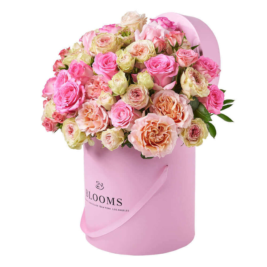 This large floral gift features pink and white roses gathered into a pink hat box for a wonderful way to breath of spring in any space.. Los Angeles Delivery