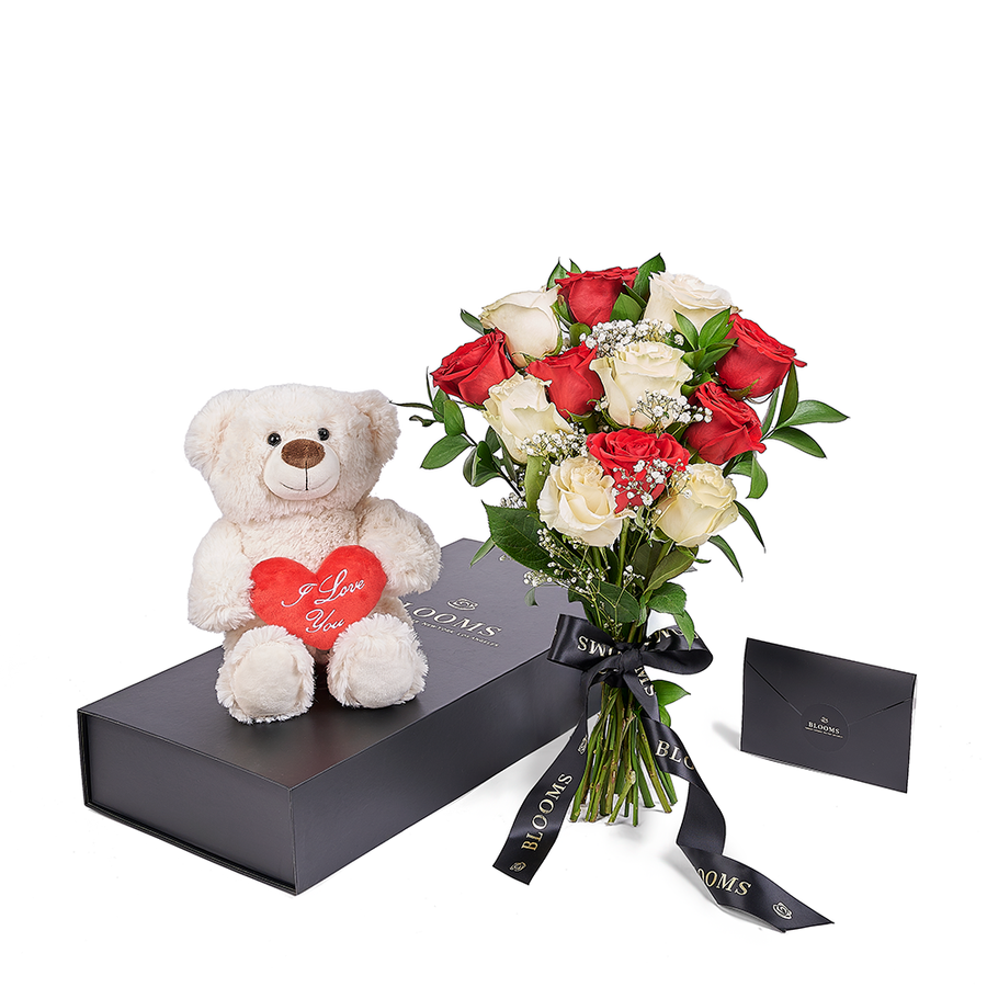 Your sweetheart will adore this cute keepsake white bear plush alongside a stunning bouquet of white and red roses on that romantic occasion. Los Angeles Blooms