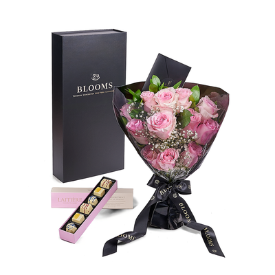 The Valentine’s Day Dozen Pink Bouquet With Box & Chocolate. Indulge your loved one's sweet tooth with some gourmet chocolates alongside a stunning bouquet of gorgeous pink roses.