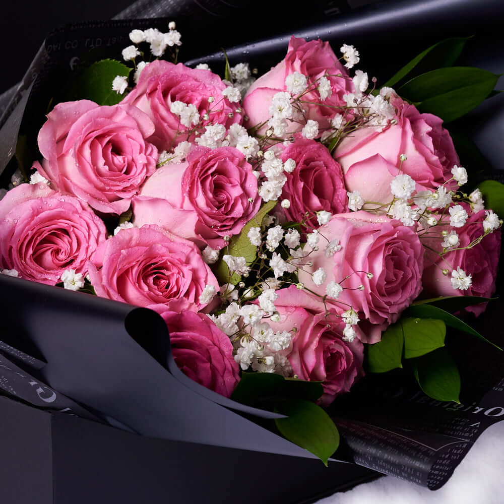 The Valentine’s Day Dozen Pink Bouquet With Box & Chocolate. Indulge your loved one's sweet tooth with some gourmet chocolates alongside a stunning bouquet of gorgeous pink roses.