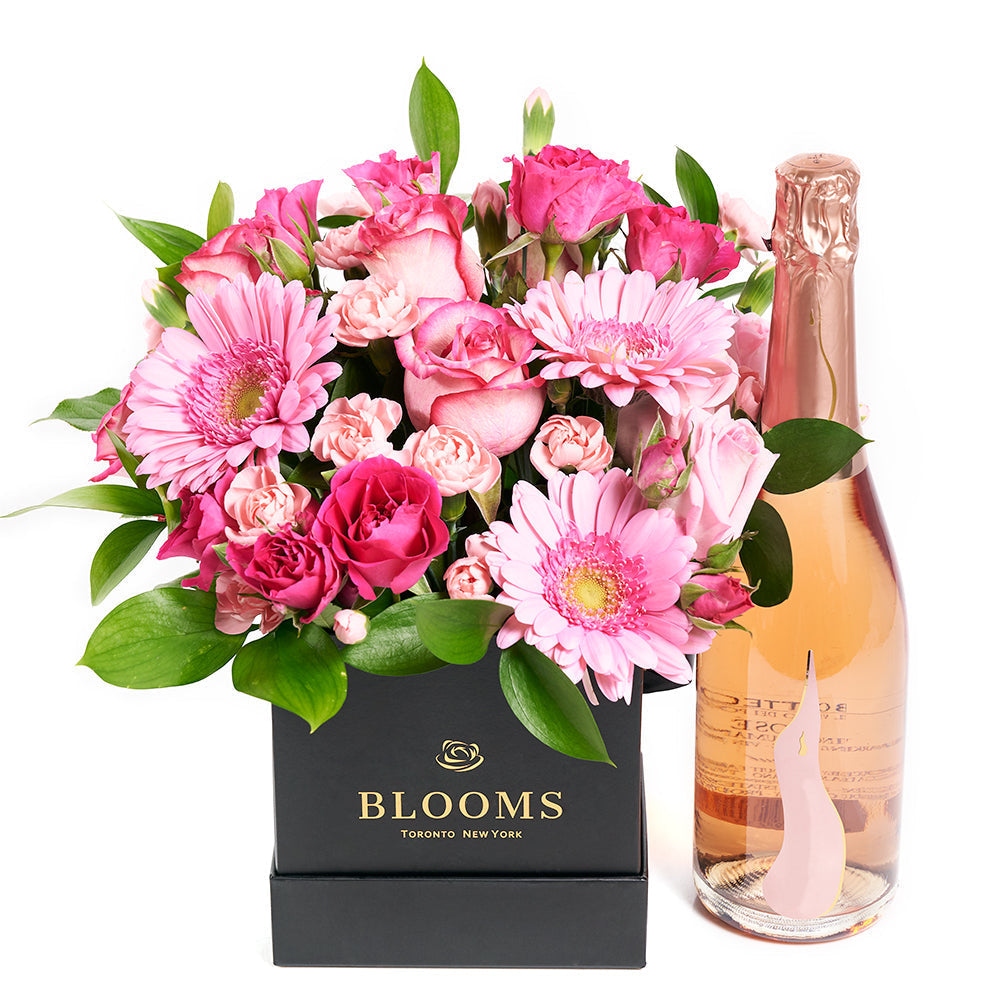 Black Designer Hat Box Flower Arrangement with Pink Blooms and Sparkling Wine – how the gift is presented
