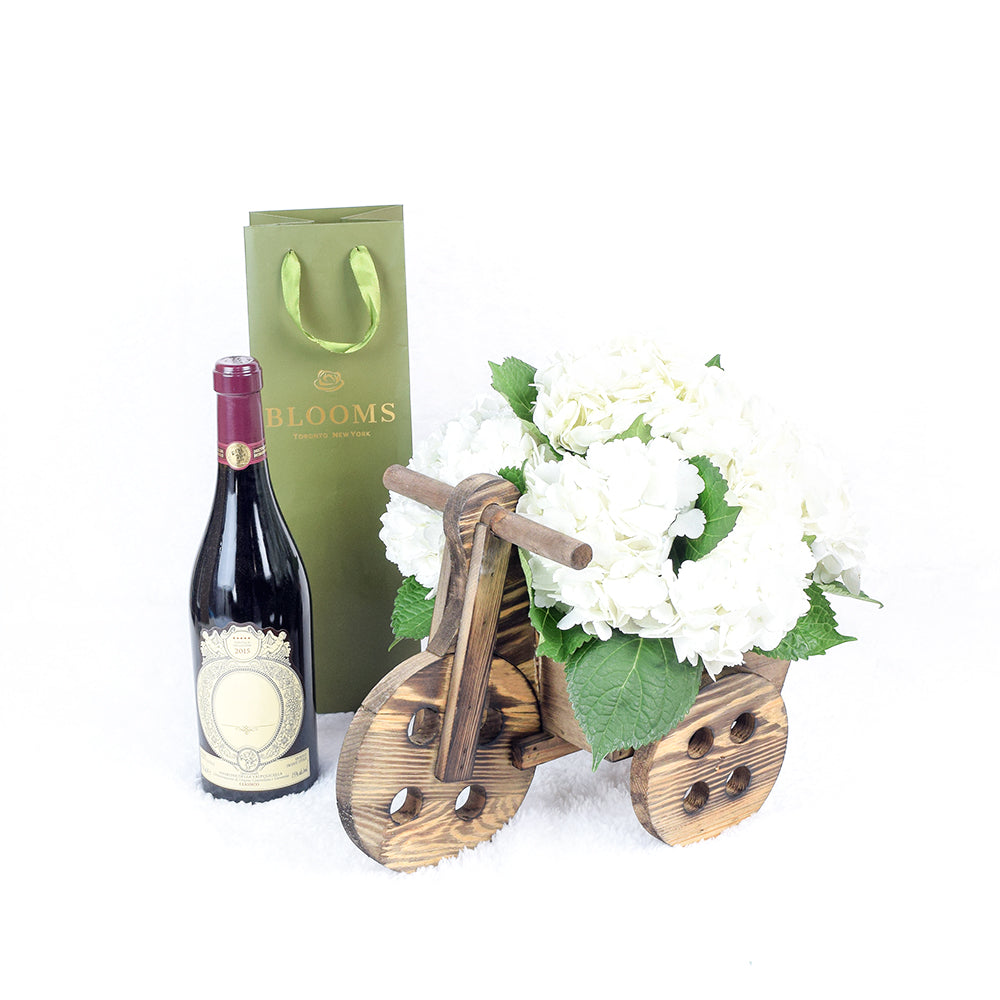 Classic White Hydrangea Flowers with Red Wine in Wooden Bicycle Planter – how the gift is presented