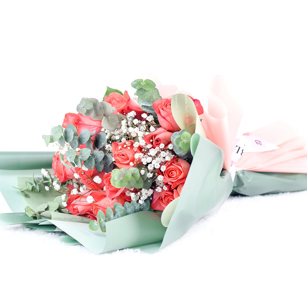 Coral Roses and Baby's Breath Bouquet in Floral Wrap – how the gift is presented