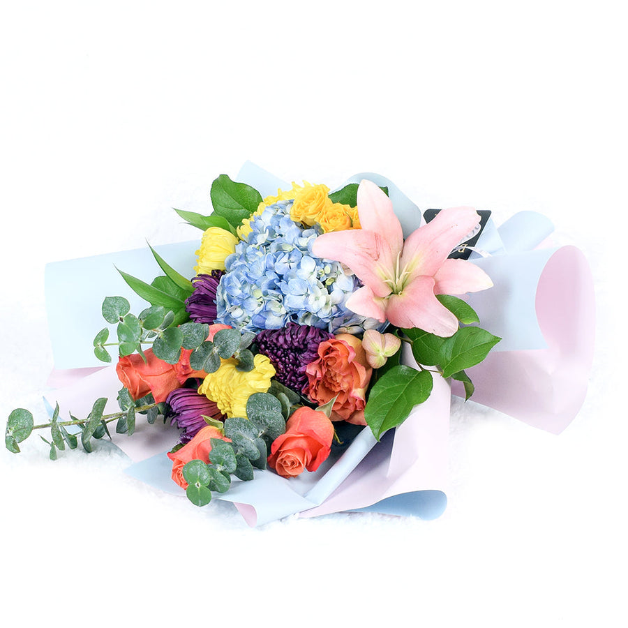 The Festive Purim Bouquet from Los Angeles Blooms features a cheerful arrangement of roses, cremons and other flowers tied with a designer ribbon