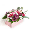 Pink and white mixed floral arrangement in a pink toolbox. Los Angeles Blooms- Los Angeles Delivery