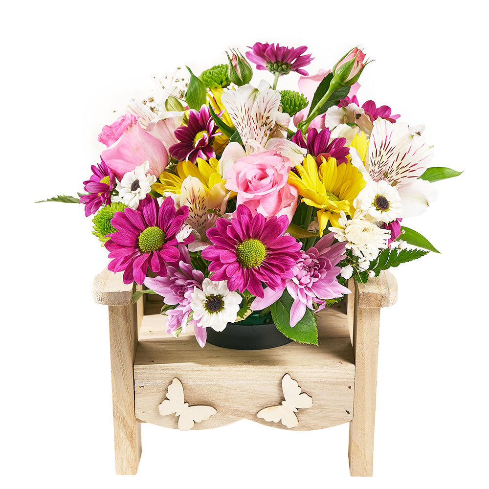 Elegant Roses, Alstroemeria, and Daisies Floral Arrangement in Planter Chair – how the gift is presented