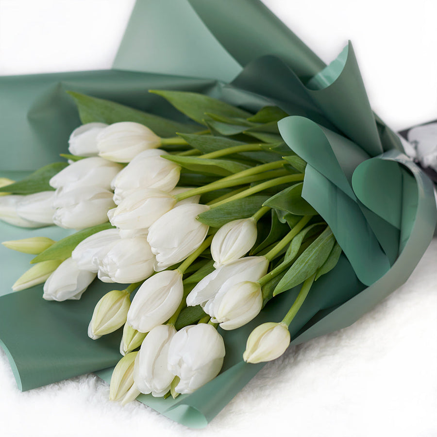 In crisp white tones, the Spring Scents Tulip Bouquet from Los Angeles Blooms symbolizes love and comfort.Los Angeles Delivery