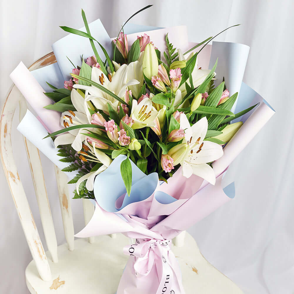 Deluxe Mixed Lilies and Alstroemeria Floral Wrap Bouquet – how the gift is presented