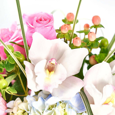 This gift highlights the beauty of hydrangeas, cymbidium orchids, roses, and more in a lovely hat box that makes a lovely centerpiece.  Los Angeles Blooms